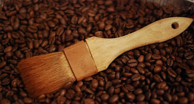 Paintbrush and coffee beans